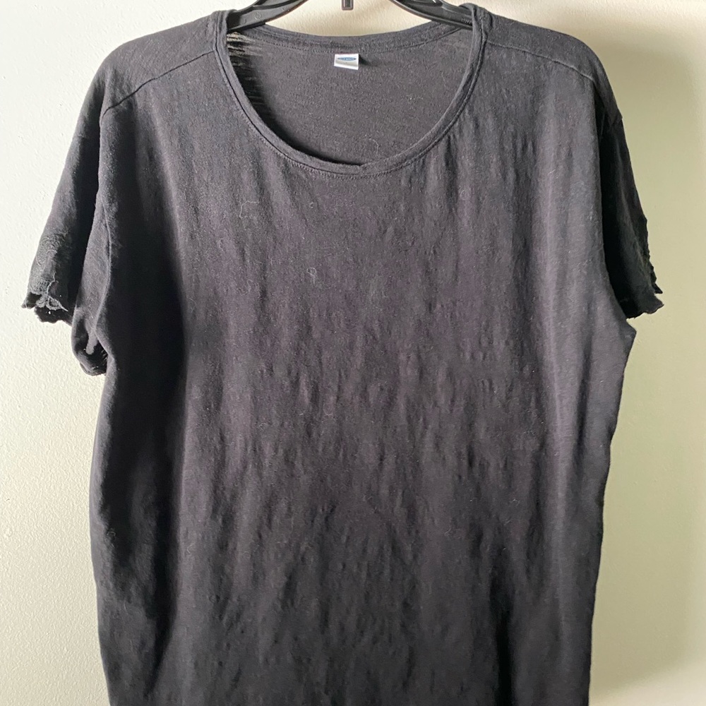 Black tee with lace on sleeves.